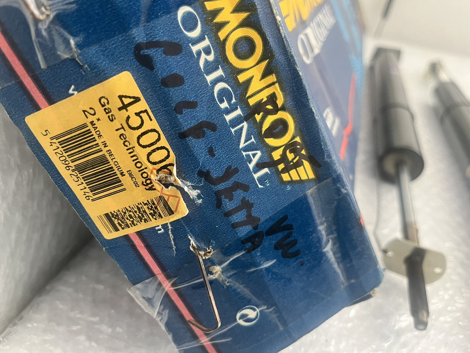 6993854