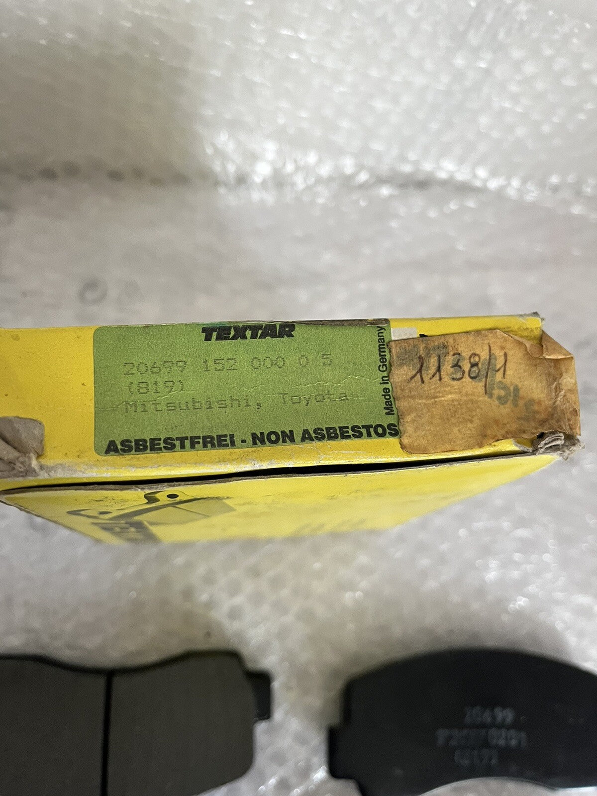 6994077